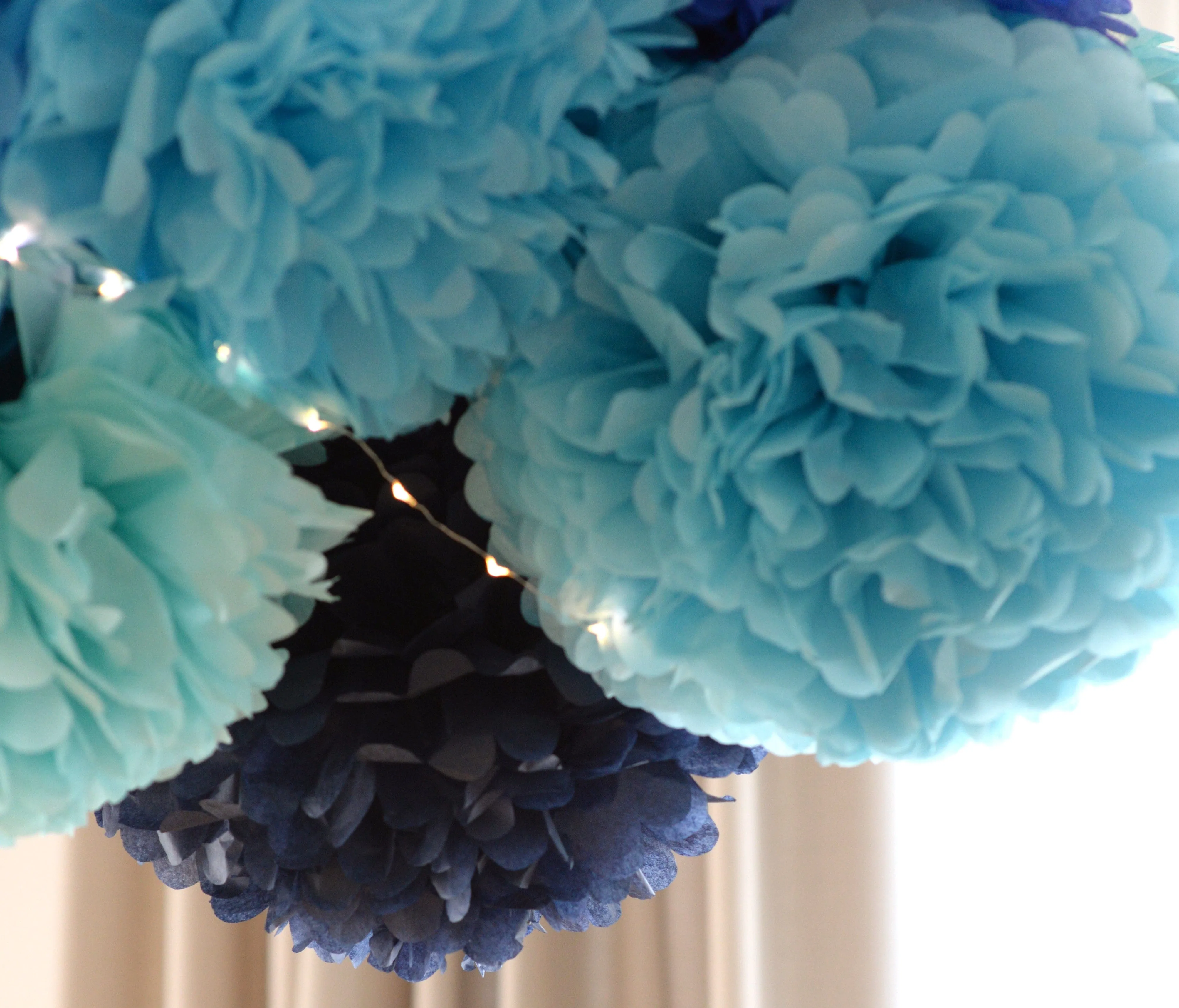 All blue tissue paper  pom poms party set